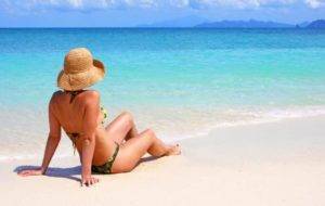 Woman Taking Beach Sun Tanning
